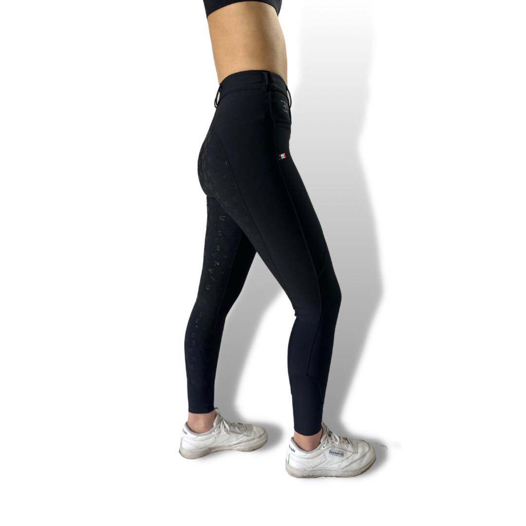 Black high-waisted leggings worn as Staple Black Breeches, perfect riding tights for equestrians