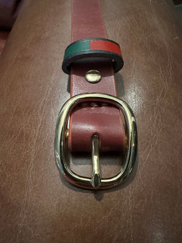 100% Leather Hyde Belt featuring brass buckle and green-red accent for breeches