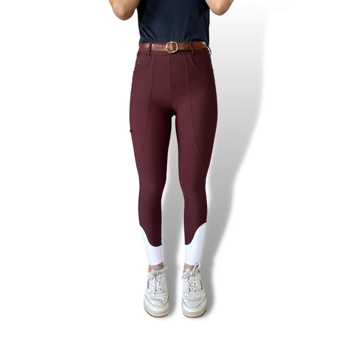 High-waisted burgundy leggings with a belt, perfect for breeches and riding tights