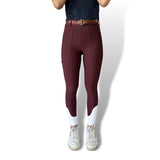High-waisted burgundy leggings with a belt, perfect for breeches and riding tights