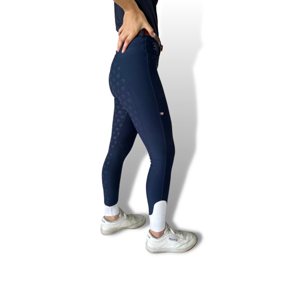 Navy blue Classic Navy XT Breeches paired with white sneakers for stylish athletic wear