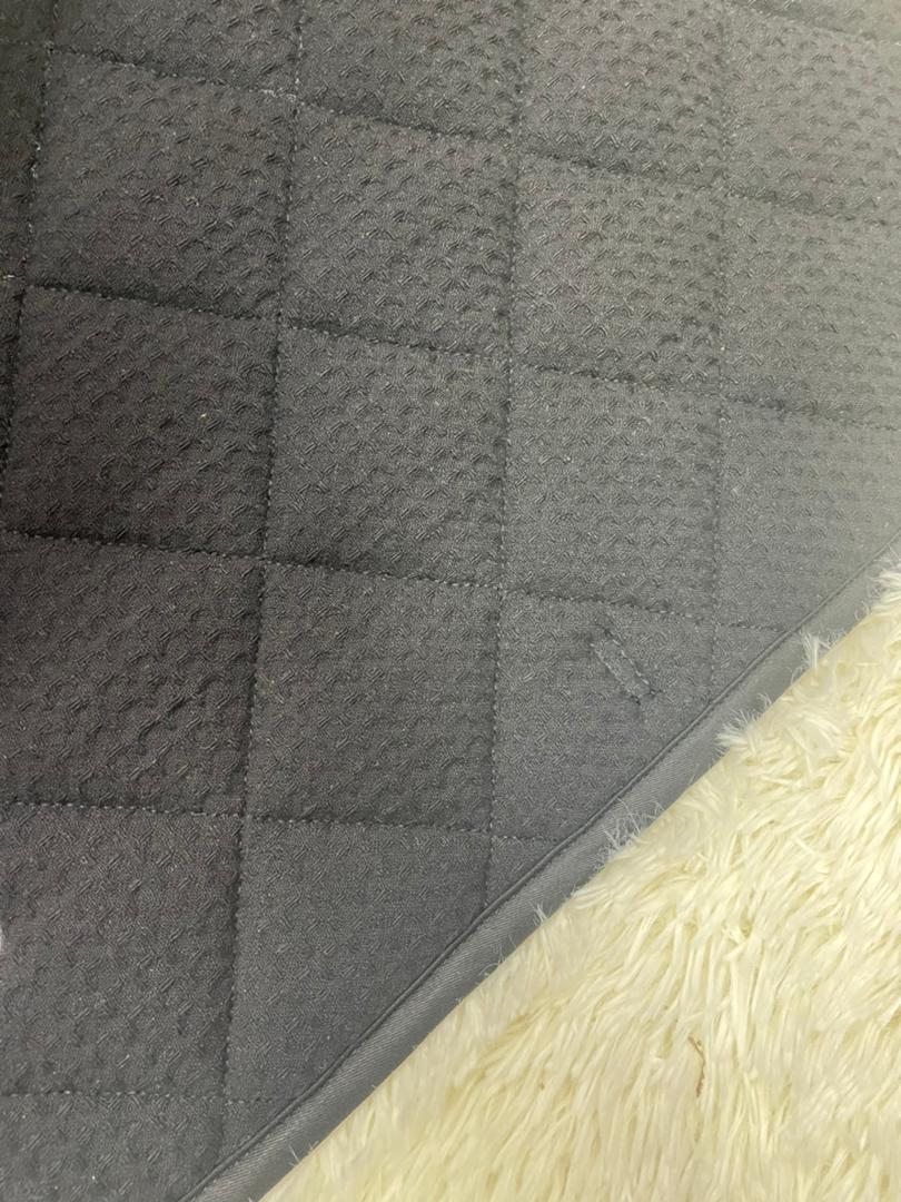Quilted gray fabric with diamond pattern on Equus Elite Saddle Pad for ultimate comfort