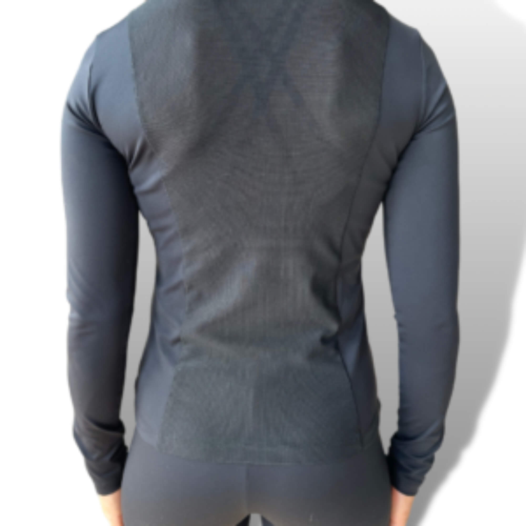Gray long sleeve athletic shirt viewed from the back, ideal for riding tights and breeches
