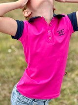 Bright pink kids matching polo shirt featuring logo, perfect for riding tights and breeches
