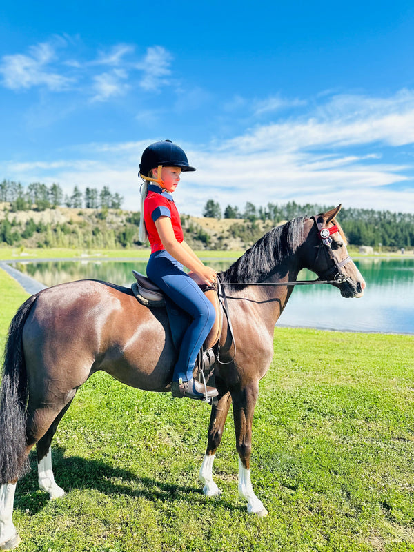 Horse and rider in red shirt and blue helmet, perfect for Kids Matching Polo